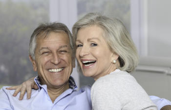 Happy senior couple with perfect smiles.
