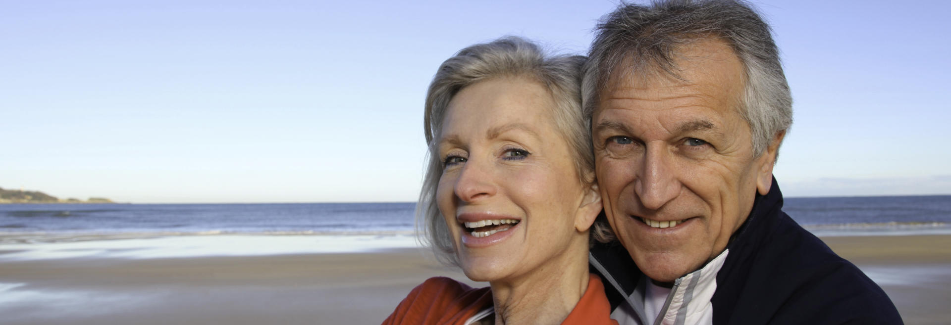 Happy mature couple with perfect smiles.