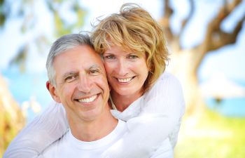 Joyful mature couple with perfect smiles.